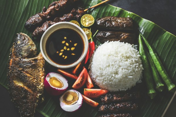 Filipino home-cooked meal served on banana leaves